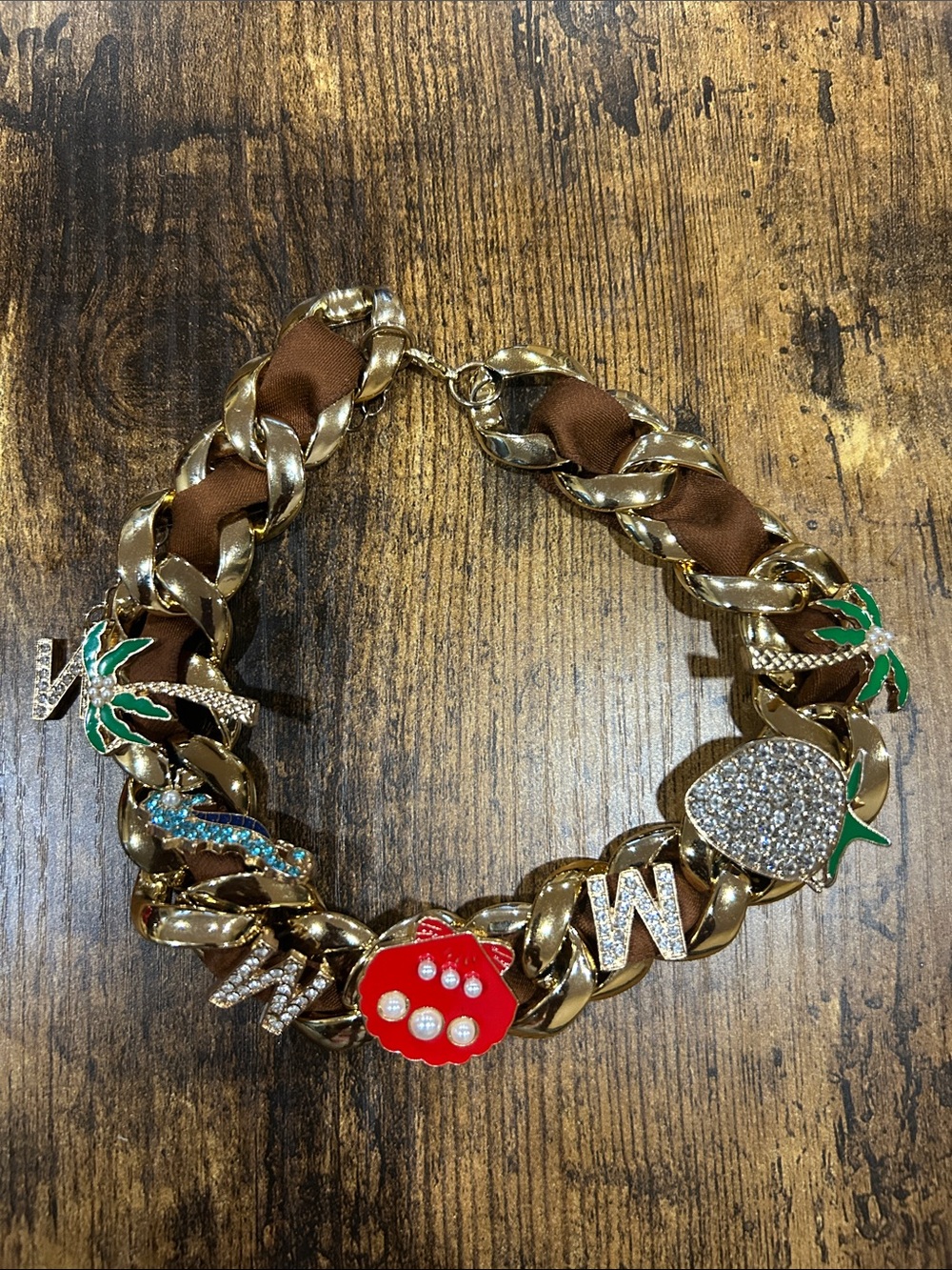 Gold-Tone Charm Statement Necklace with Red Enamel Flower